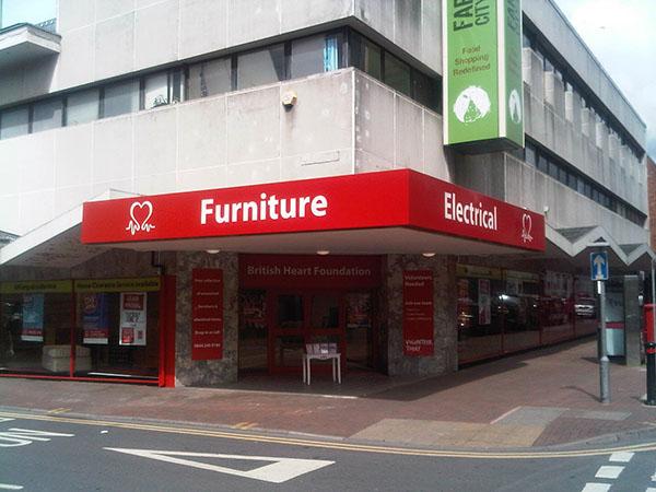 Red furniture shop at the corner of the street. 