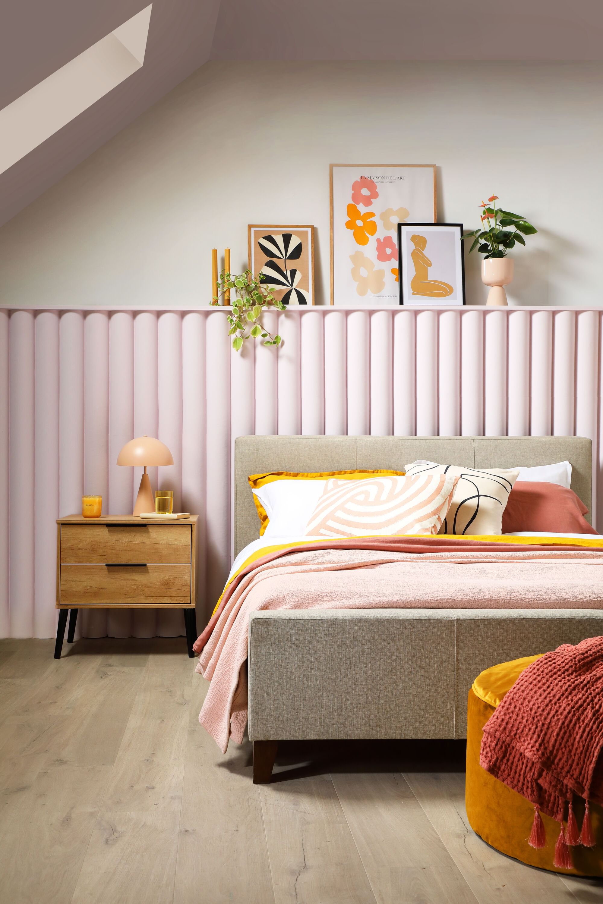 A stylish bedroom with fluted wall panelling