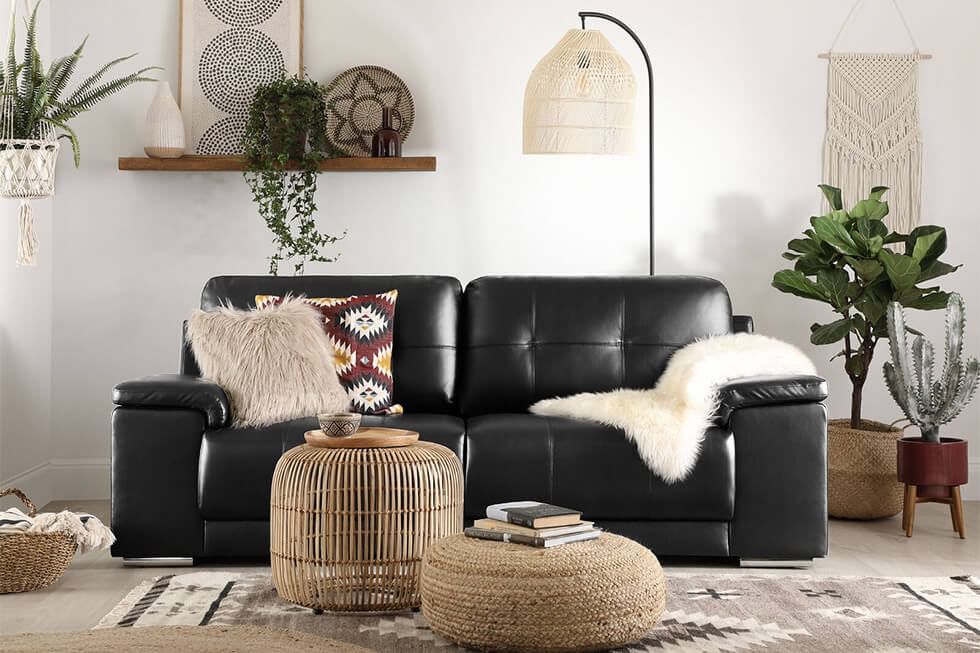 Black sofa in laidback modern boho living room