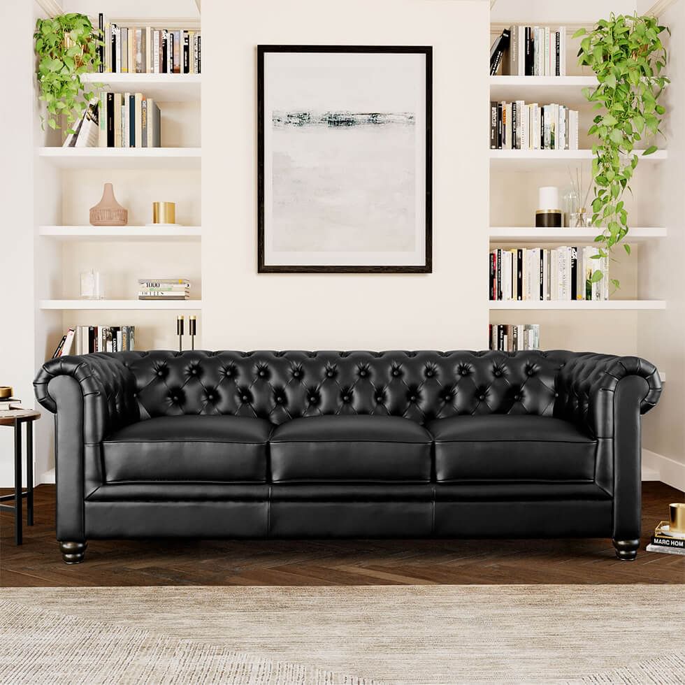 Black Chesterfield sofa in a classic neutral living room
