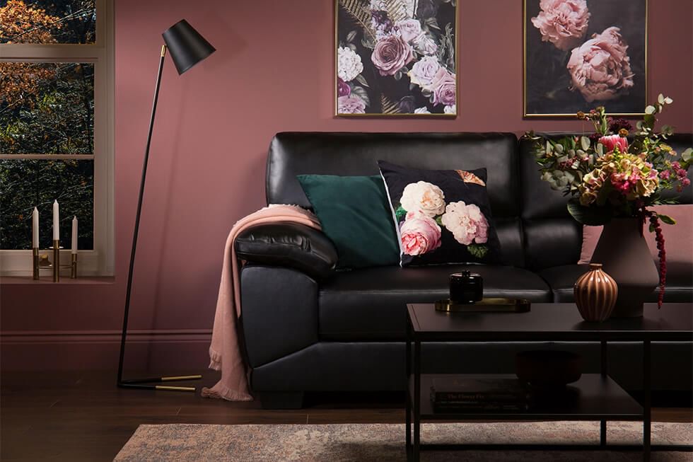 Black sofa in modern jewel tone living room