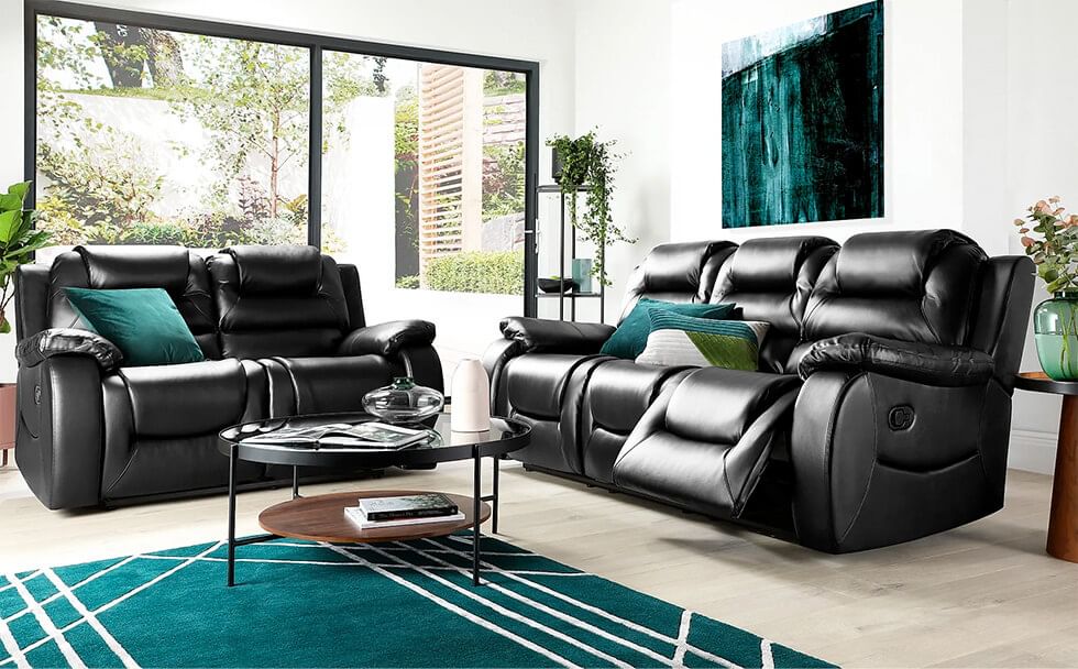 Black sofa recliner set in a teal living room