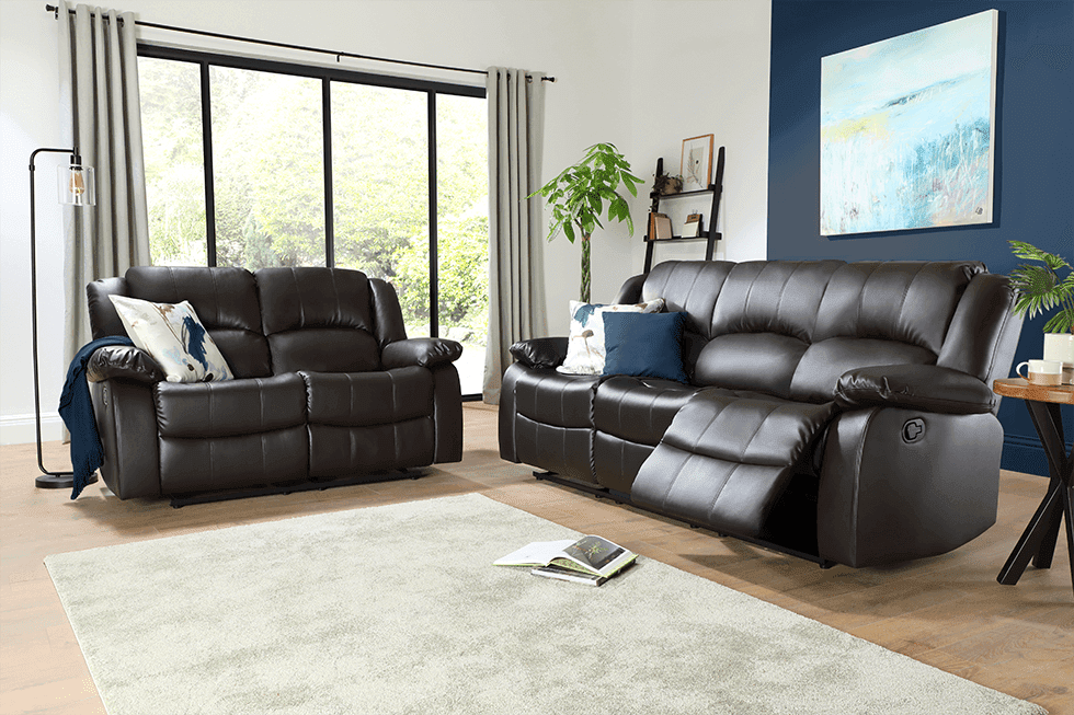 A brown leather sofa set in a blue living room