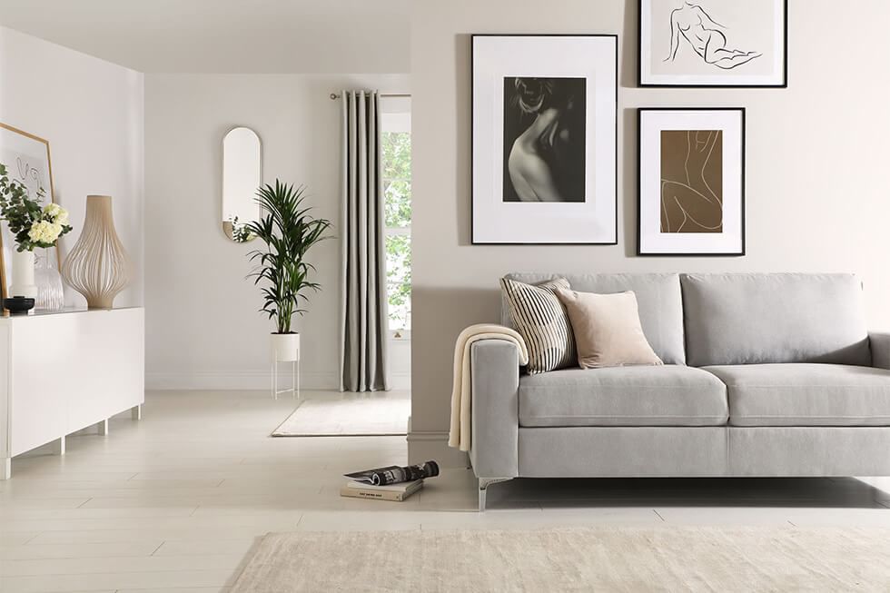 https://www.furniturechoice.co.uk/v5/img/hier/advice-and-inspiration/what-colours-go-with-a-grey-sofa/01-grey-sofa-in-a-minimalist-white-living-room.jpg