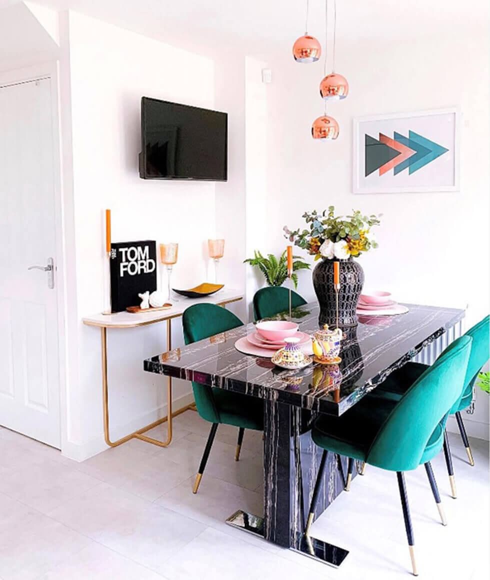 A blue, yellow and white dining room with a white dining set