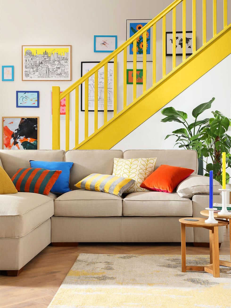 A blue, yellow and white dining room with a white dining set