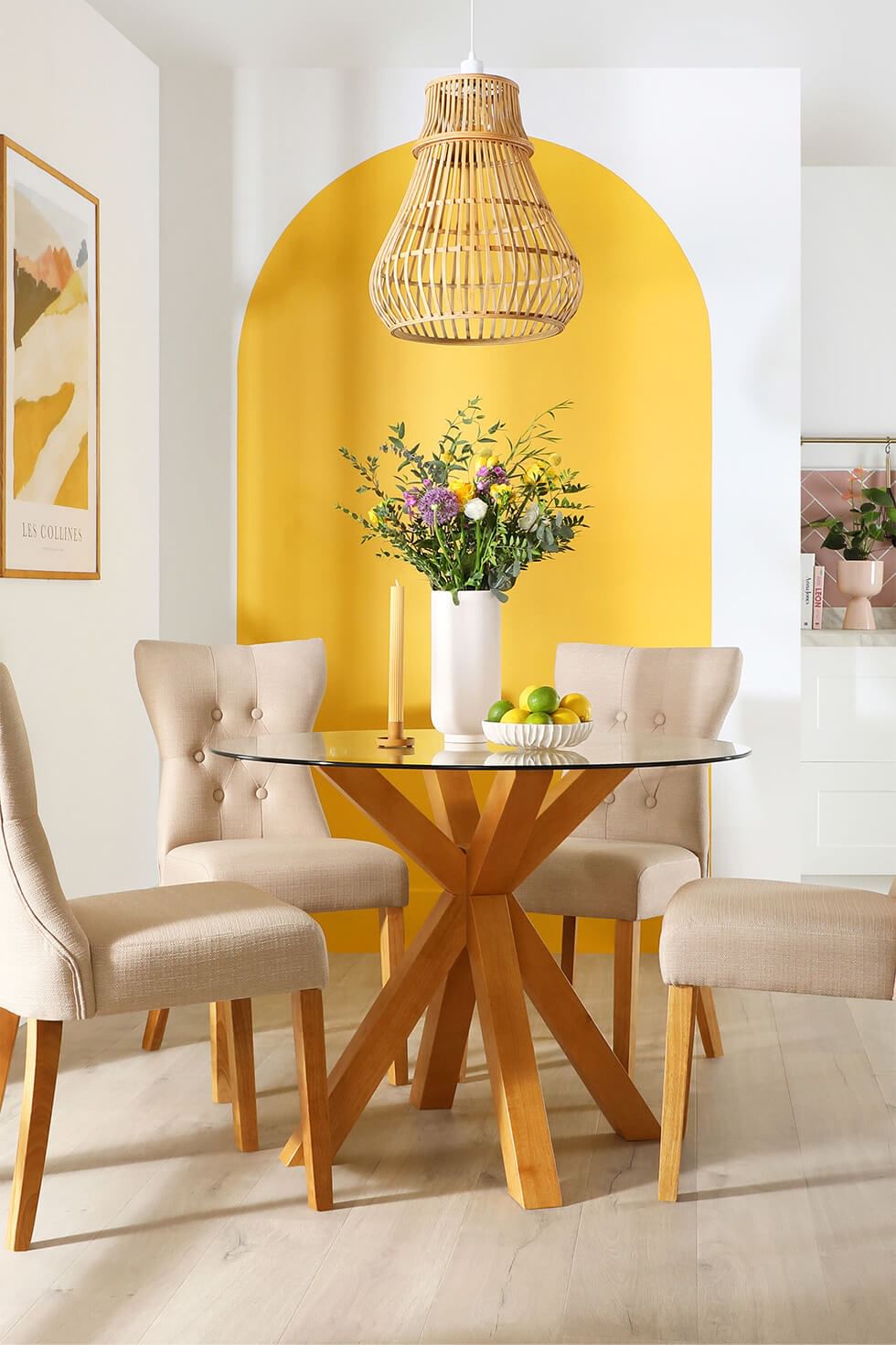 A blue, yellow and white dining room with a white dining set
