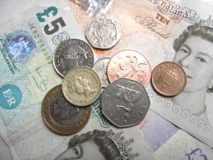 Assortment of British bank notes and coins.
