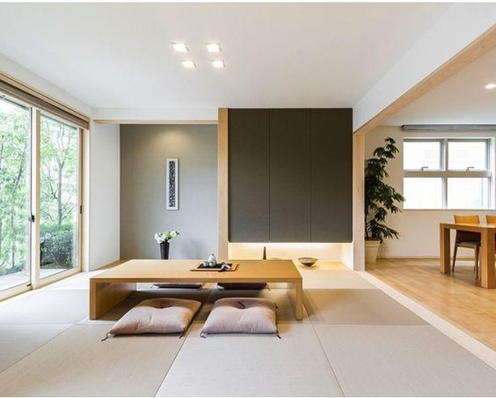 Open plan space with tatami mats and low wooden table.
