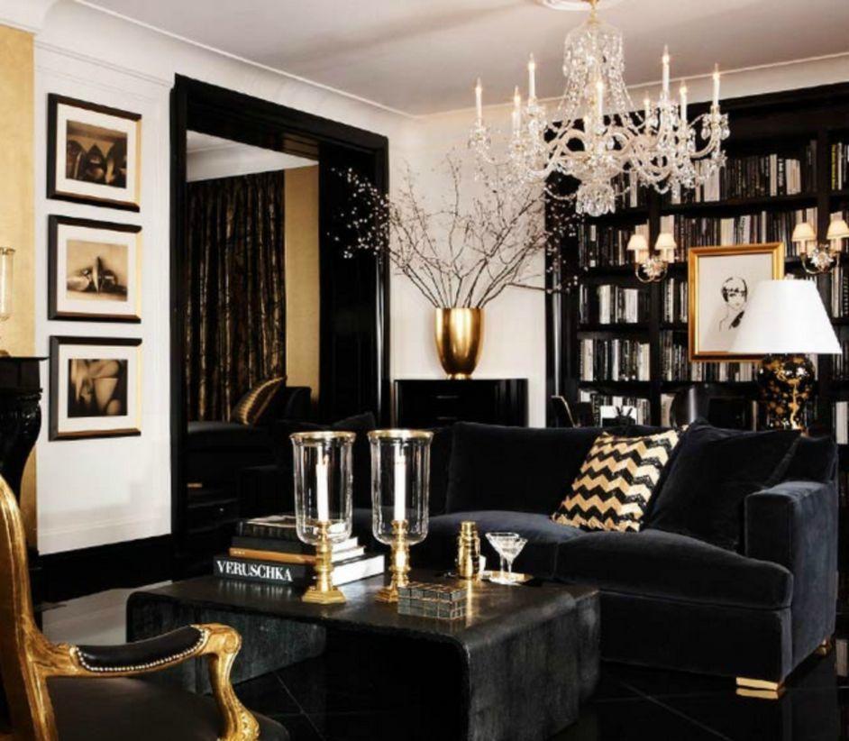 Art Deco style living room with monochrome furniture, gold details and chandelier.