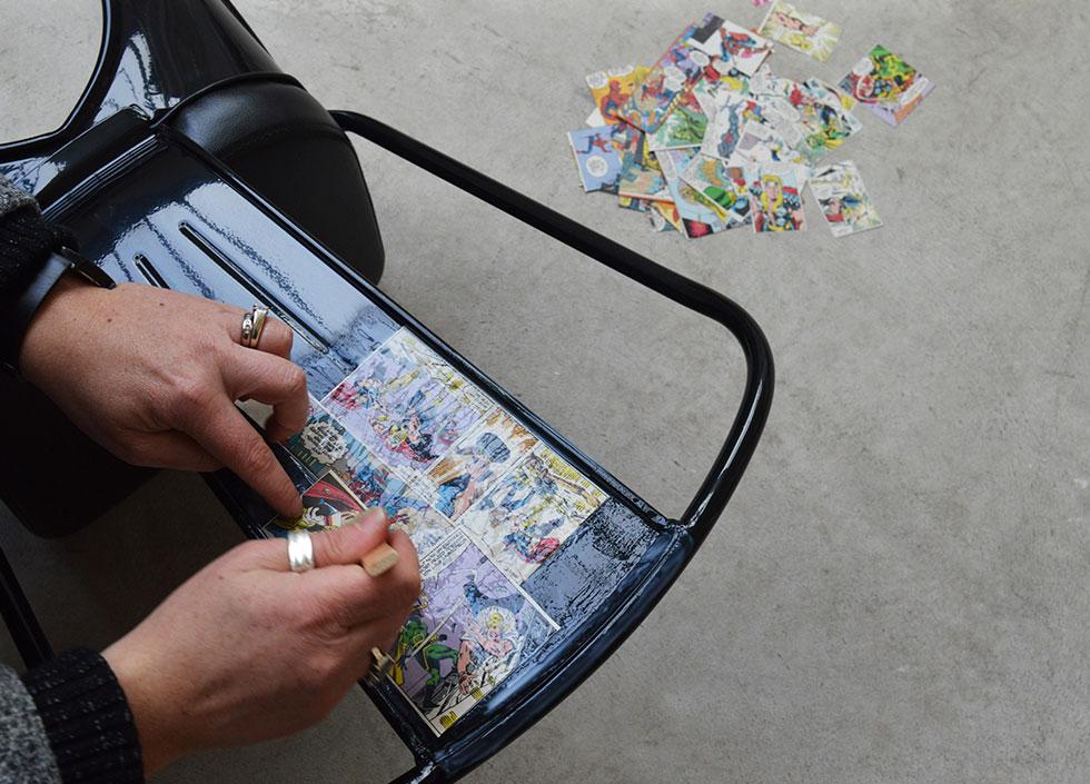 gently stick the comic clippings onto the chair