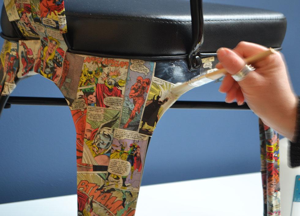 Once all areas are covered with the comics, apply a thin coat of glue over the surface to seal them in